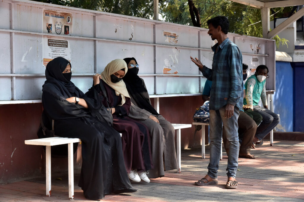 Man abusing Burqa women at bus stop in Hyderabad absconding