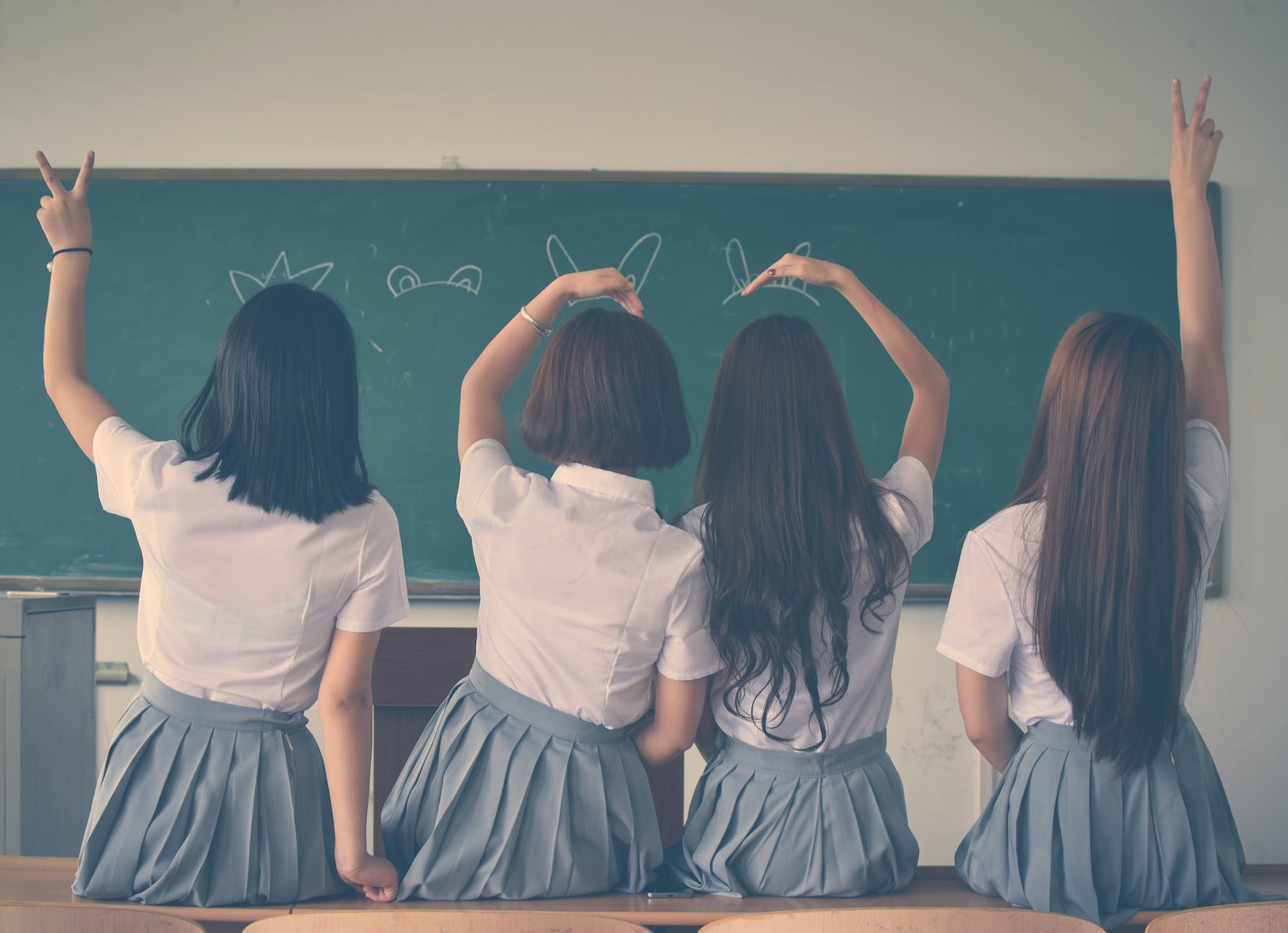 photo of four girls wearing school uniform doing hand signs, Schools Not Listening KCR