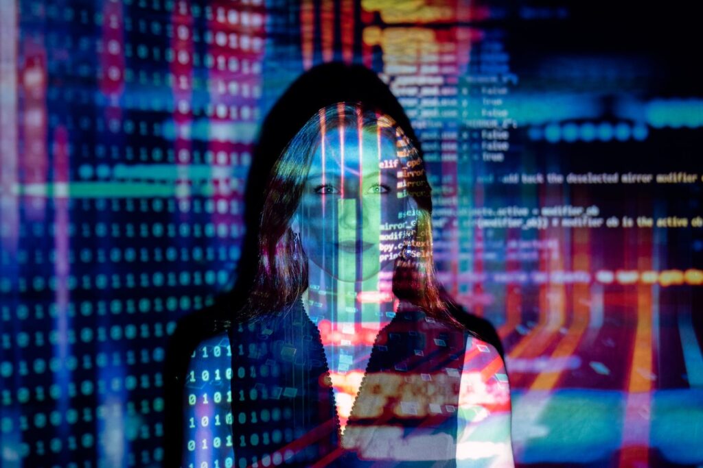 code projected over woman, Can AI replace humans, 2030, Artificial Intelligence, Your Business is Market